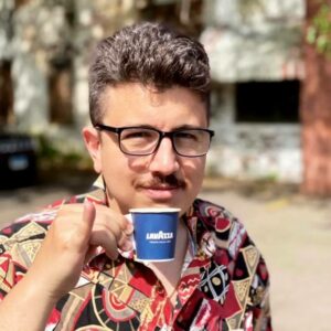 Stephen Cerulli holding an espresso cup